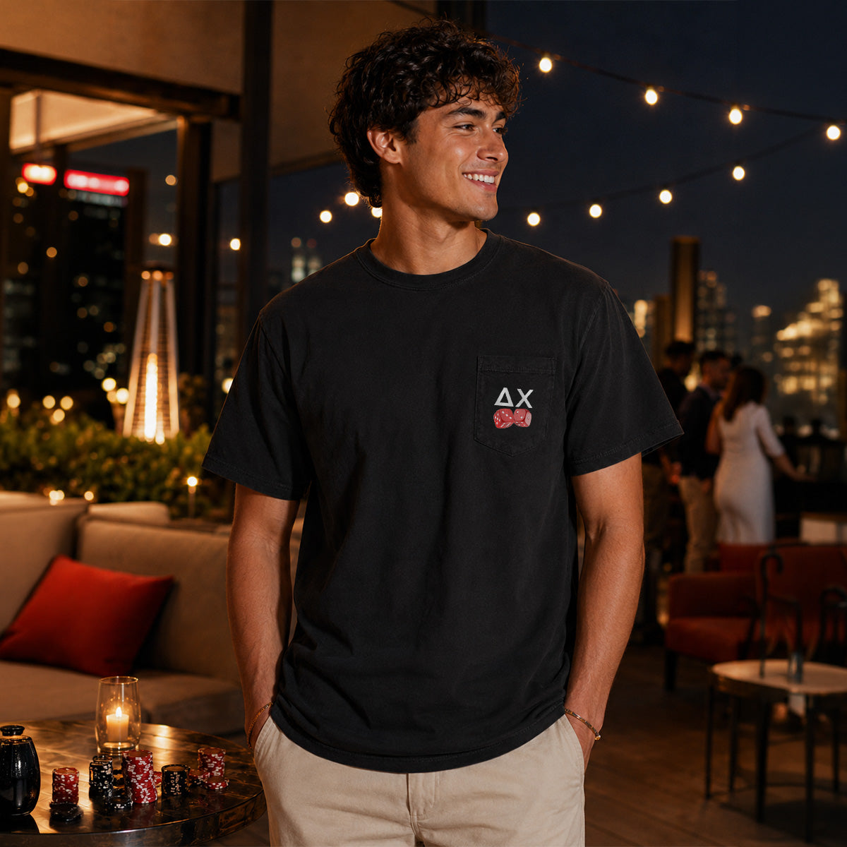 Model wearing the High Roller Tee from the front, featuring a chest pocket dice graphic on a black Comfort Colors tee.