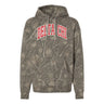 Delta Chi Deadwood Camo Hoodie featuring an all-over woodland camouflage print, red and white arched Delta Chi lettering, drawstring hood, and kangaroo pocket.