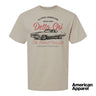 Beige T-shirt displayed on a plain background with a vintage-inspired graphic of a classic muscle car, mixed typography, and a soft red and black print design.